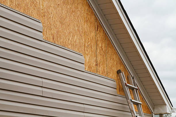 Professional Siding Contractor technician working in Wellsville, PA